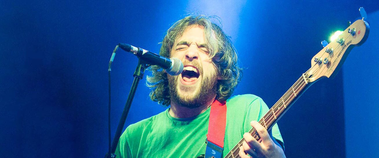 Guitarist green tshirt IMC banner