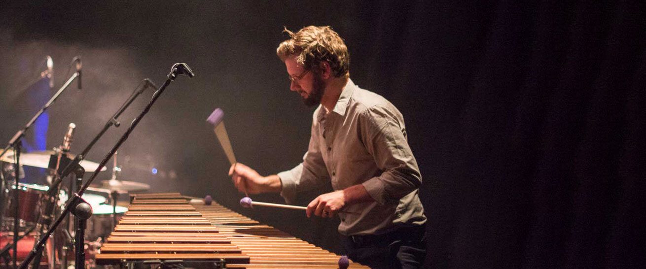 Marimba player dark background banner